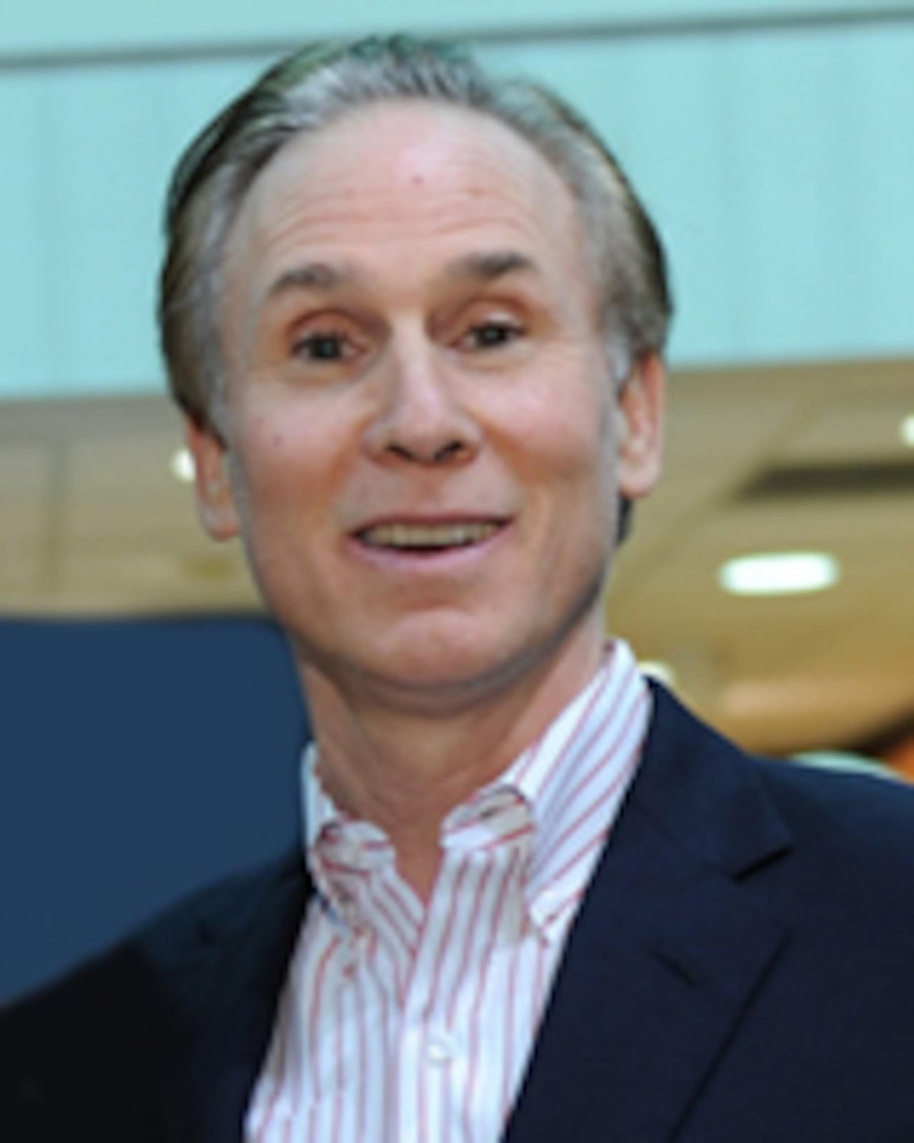 Headshot of American businessman Charles L Shor